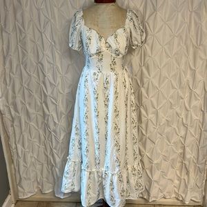 White dress with green print of flowers